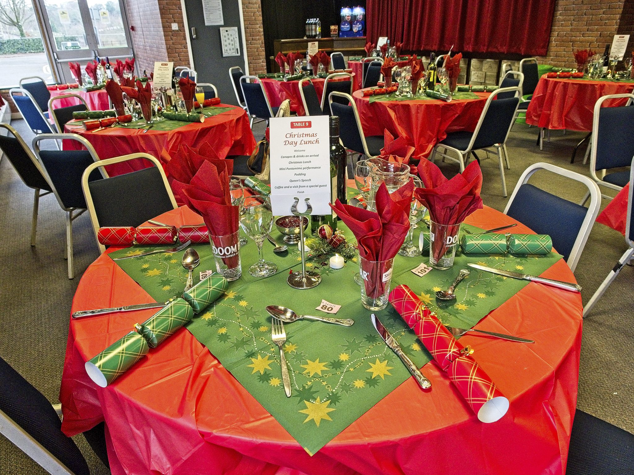 Image of table setup for Christmas Day Lunch at The Harlington - festive tables clothes and crackers