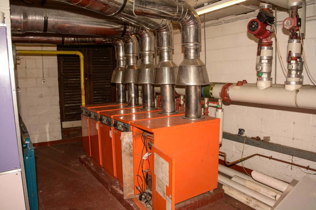 Image of boiler room in the harlington demonstrating the boilers are on their last legs