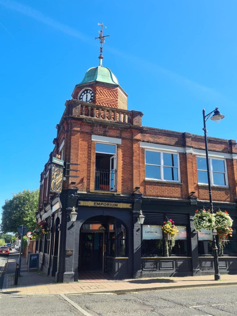 Image of the emporium pub and clocktower on a sunny day
