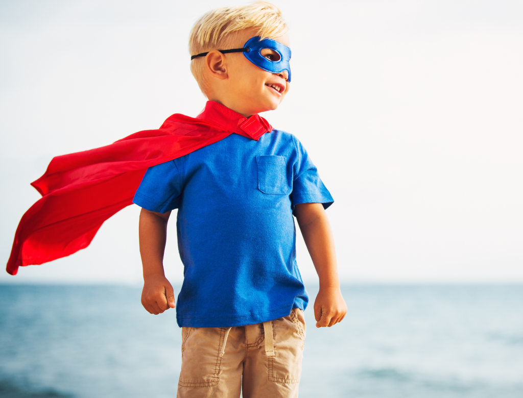 image of a child wearing a hero cape